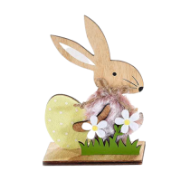 Yellow Easter bunny with egg and flowers