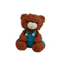 Brown teddy bear with blue pants