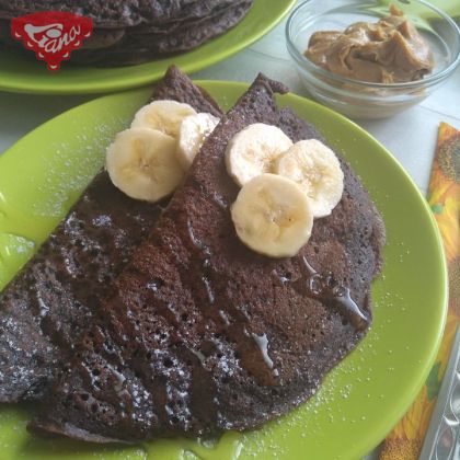 Gluten-free chocolate pancakes with peanut butter and bananas